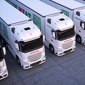 LKW von Westfleisch stehen nebeneinander auf einem Parkplatz. Sie sind weiß mit einem Aufdruck des Westfleisch Logos vorne am Fahrzeug. 